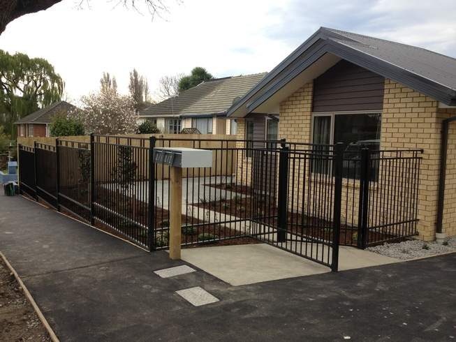 Black powder coated aluminium fence and pedestrian gate on a front boundary