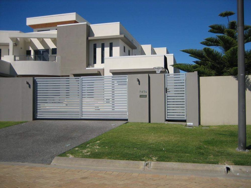 Pale powder coated horizontal slat swing gates with a matching pedestrian gate