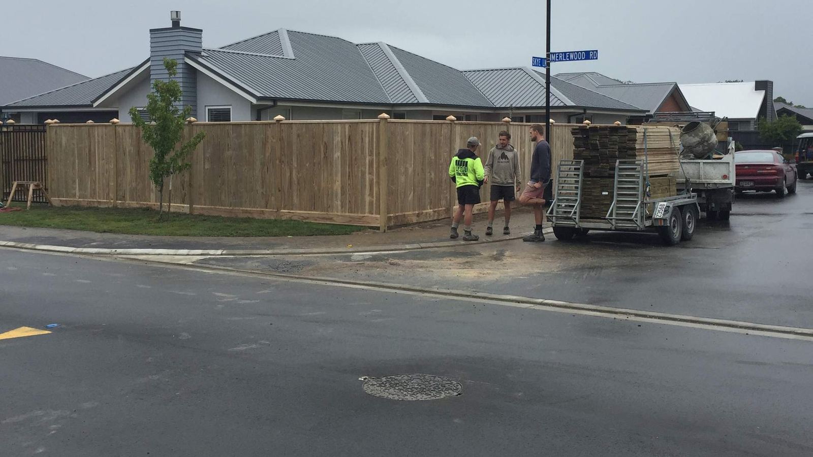 The Vogel Fencing team and truck on a completed timber fence job in Christchurch
