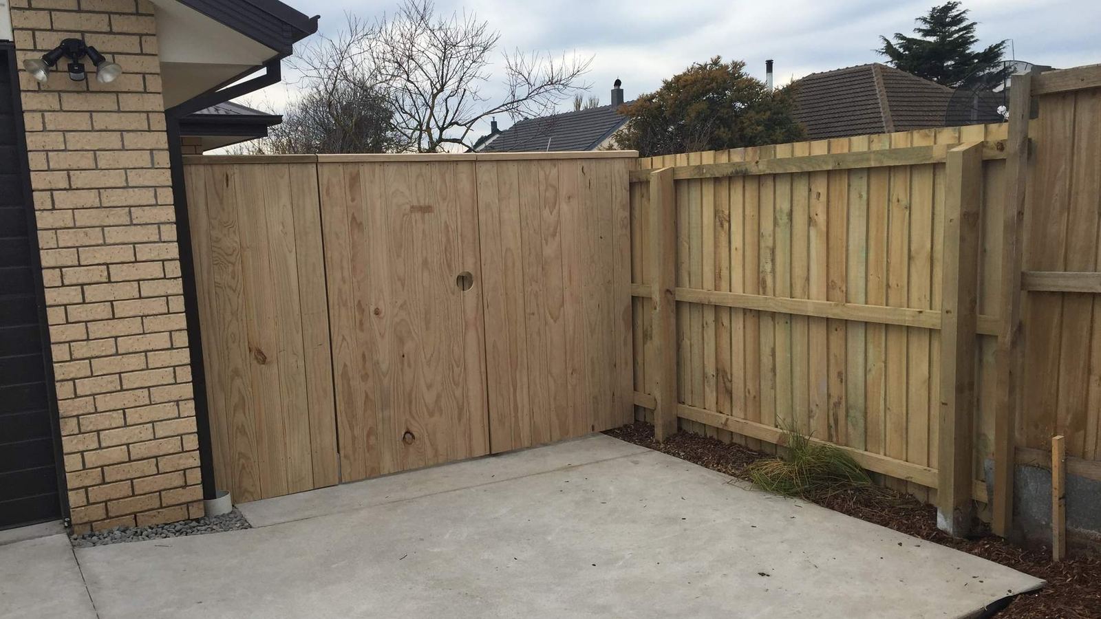 Newly built timber fence and gate enclosing a Christchurch courtyard