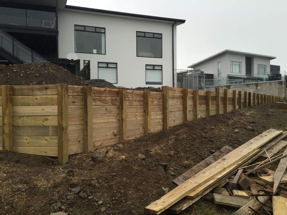 H5 pole and tongue and groove timber retaining wall on a sloping section